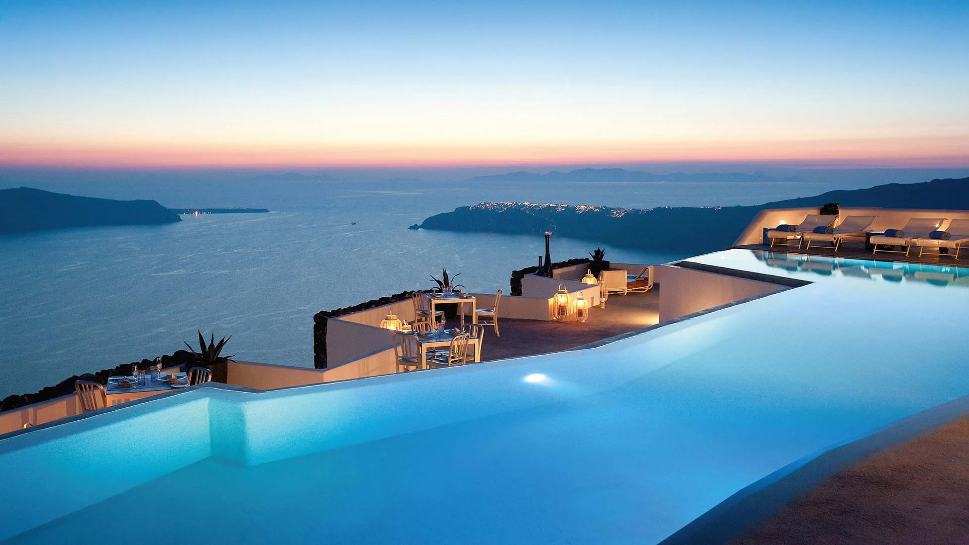 Grace Hotel Santorini infinity pool at sunset in Imerovigli