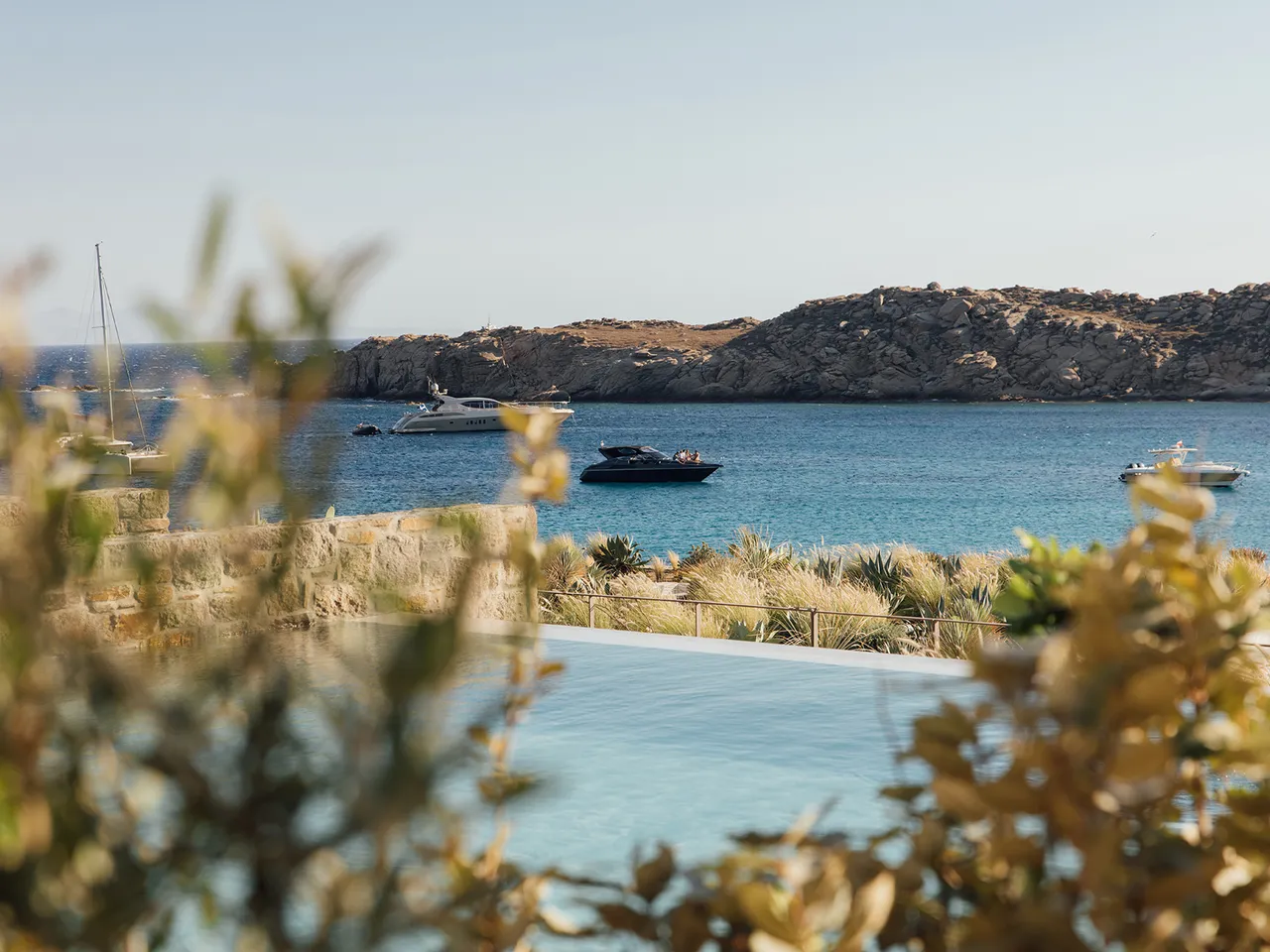 Belvedere Mykonos hillside pool overlooking Chora and the Aegean at sunset