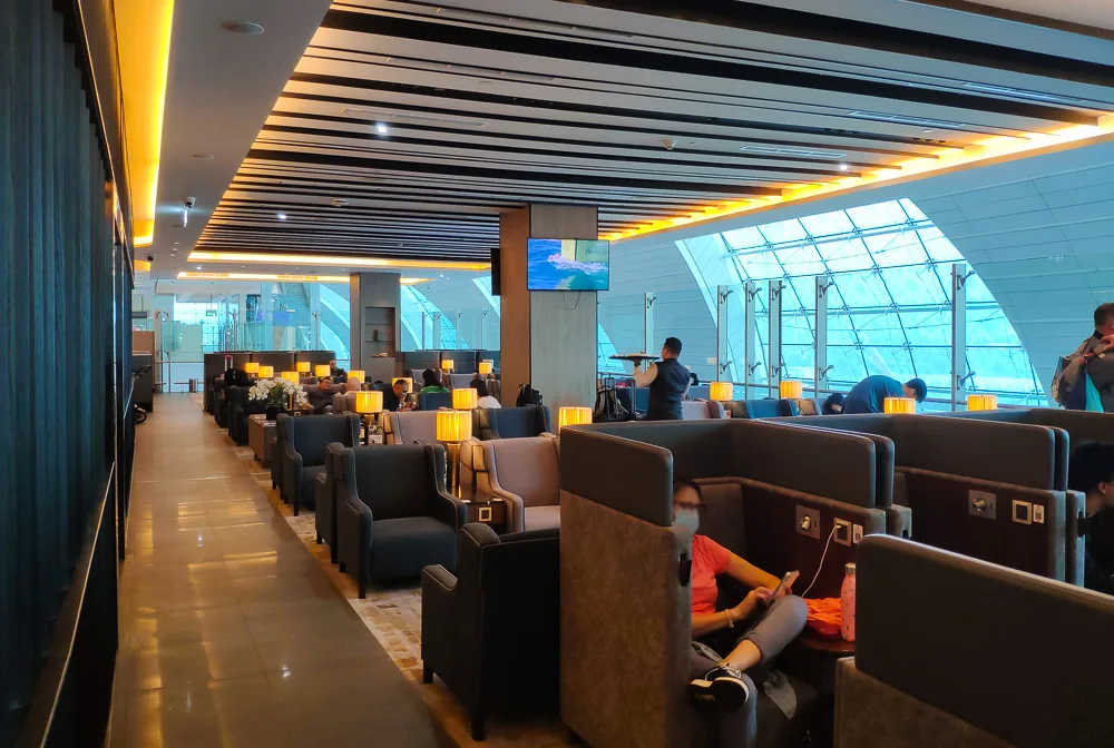 Ahlan Business Lounge at Dubai Airport Terminal 3 with warm wood and marble interior
