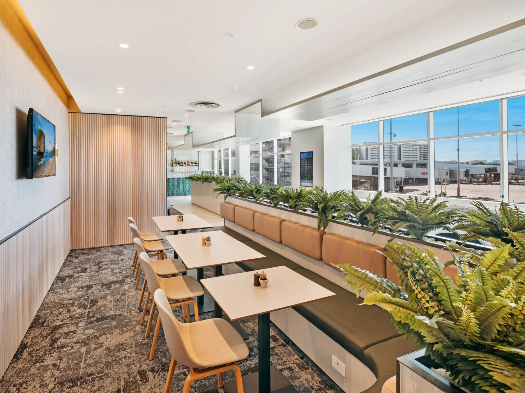 Plaza Premium Lounge at Sydney T1 International with runway view