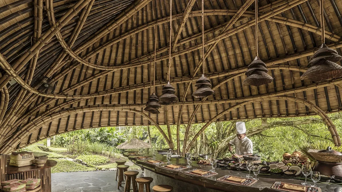 Chef cooking at the Sokasi bamboo cooking pavilion at Four Seasons Resort Bali at Sayan