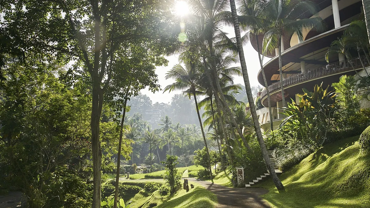 Palm shrouded main building at Four Seasons Resort Bali at Sayan at dawn