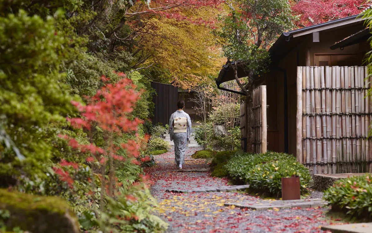 HOSHINOYA Kyoto, garden path in autumn colours leading to guest pavilion, Kyoto