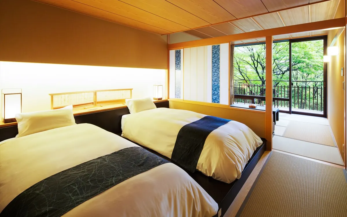 KAI Kinugawa, guest room washitsu with tatami and twin beds overlooking river, Nikko