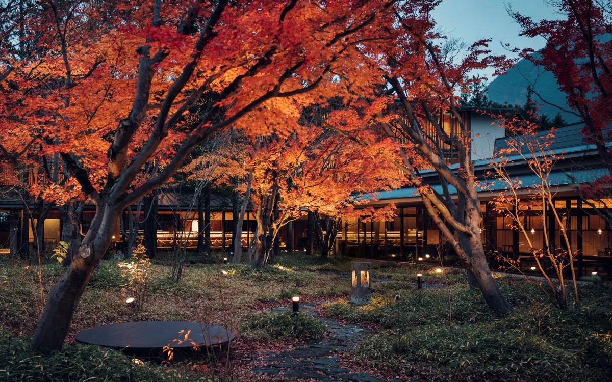 KAI Kinugawa, courtyard in autumn with red maples and Kinugawa river, Nikko