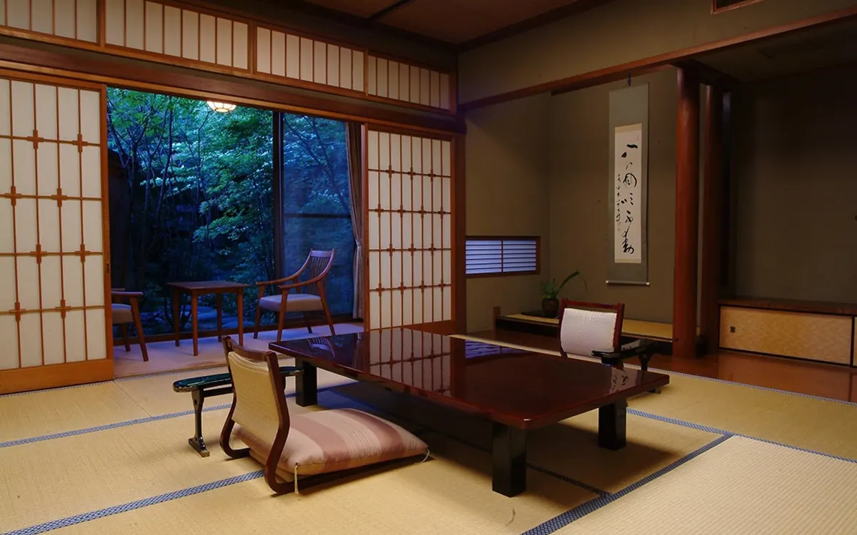 Nishimuraya Honkan, tatami guest room with low table and garden window, Kinosaki Onsen