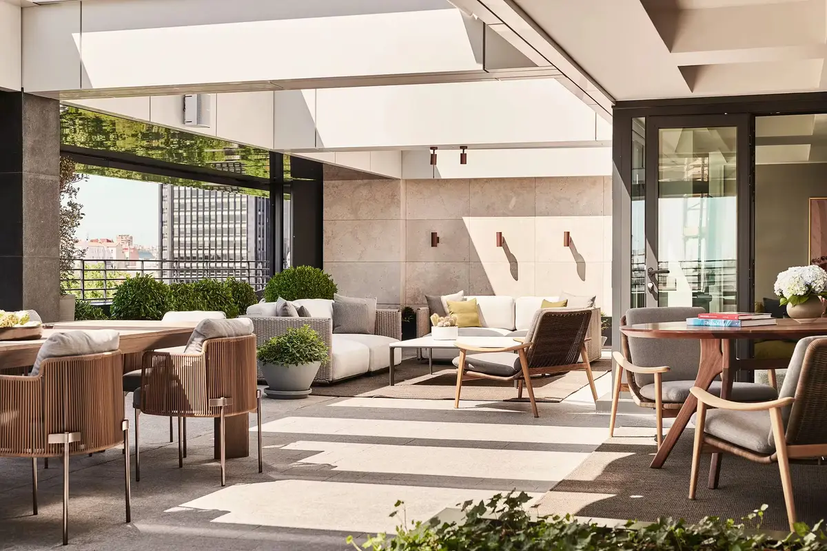 A private terrace at Rosewood Villa Magna with outdoor sofas and a view over Salamanca rooftops
