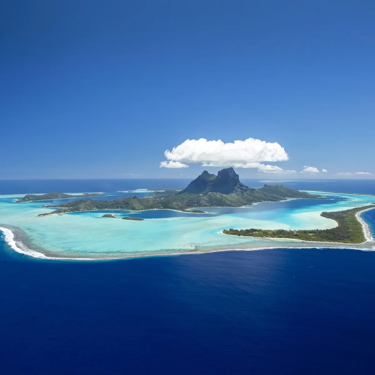 Bora Bora from the air, with Mount Otemanu rising above the lagoon and barrier reef