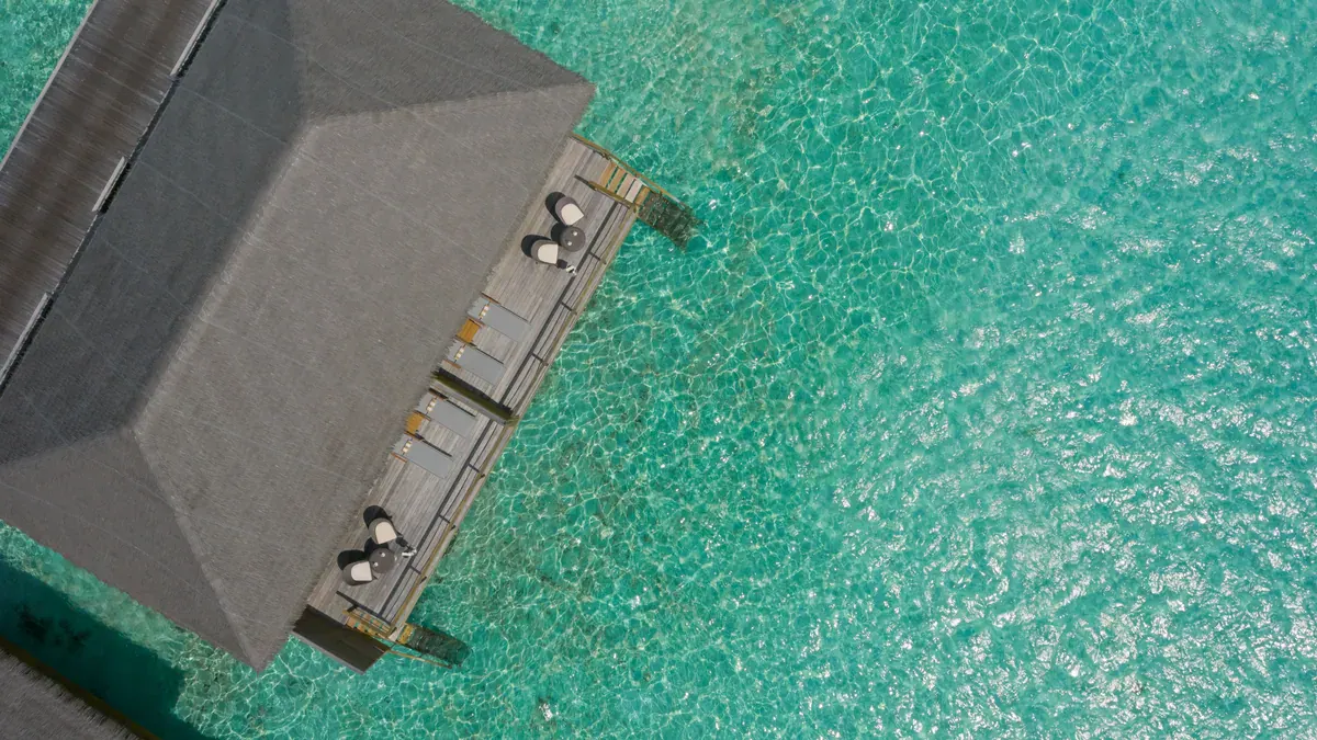 Overwater suite and deck from above at Cocoon Maldives