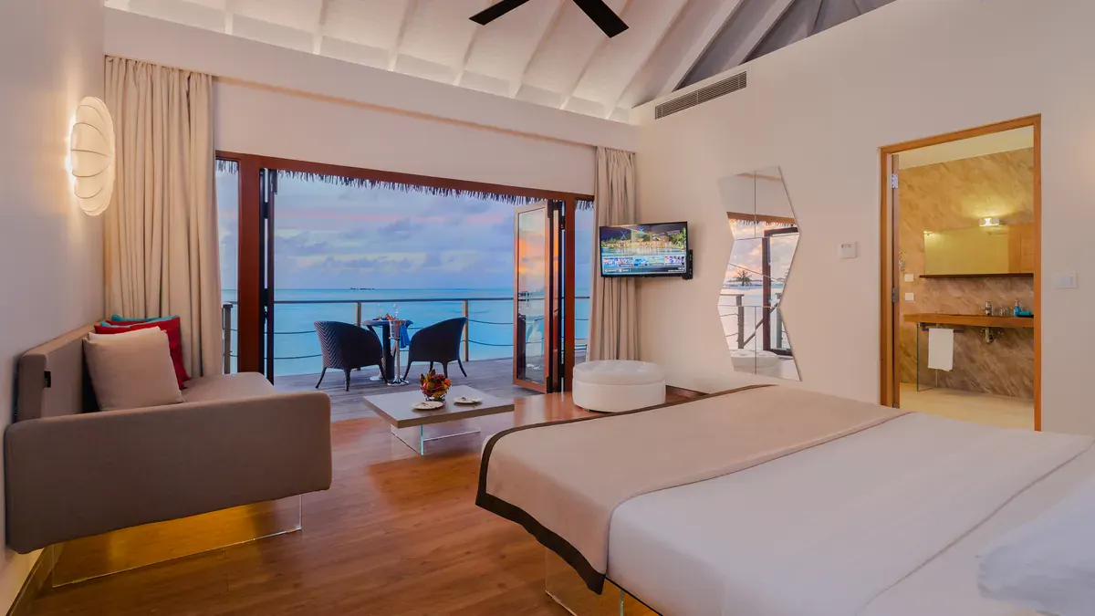 Lagoon Suite bedroom with ocean view at Cocoon Maldives
