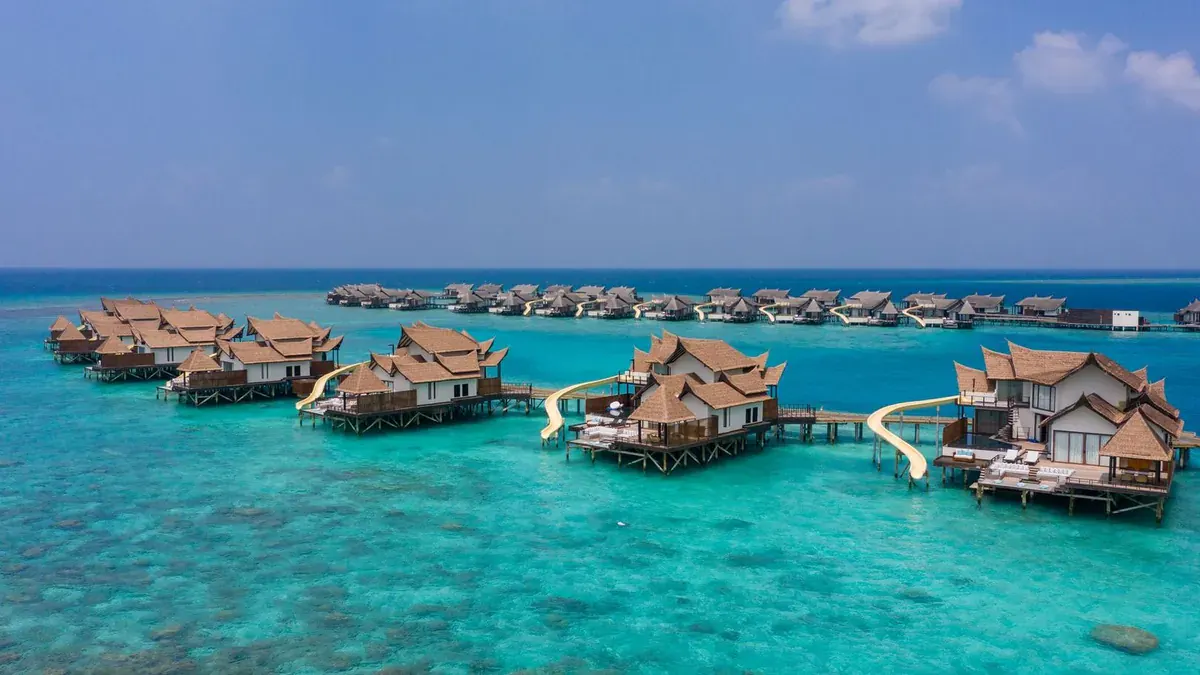 Overwater slide villas at OZEN Reserve Bolifushi in South Malé Atoll