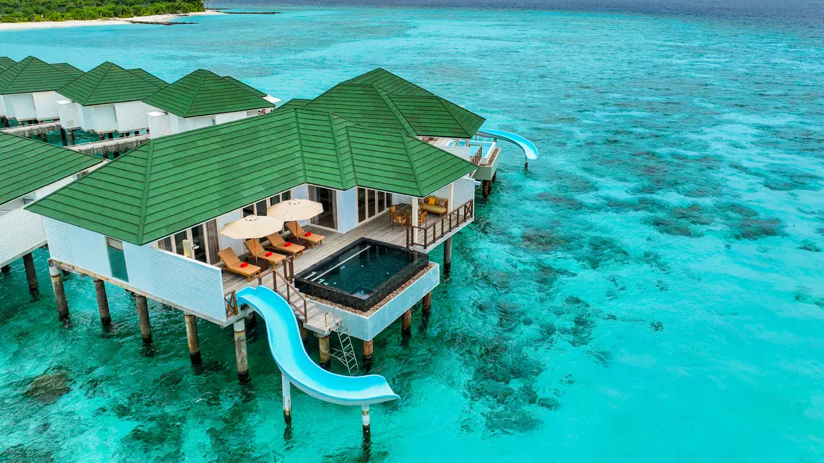 Water Villa with Pool and Slide at Siyam World in Noonu Atoll