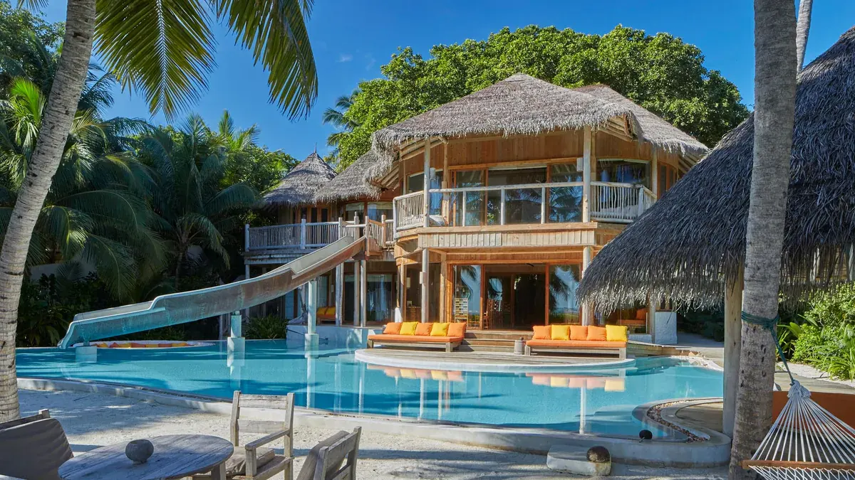 Beach villa with slide into a private pool at Soneva Fushi