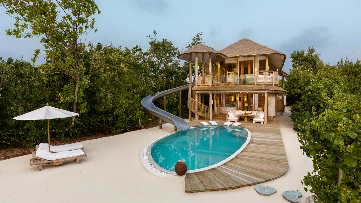 Beach villa with curved slide at Soneva Jani
