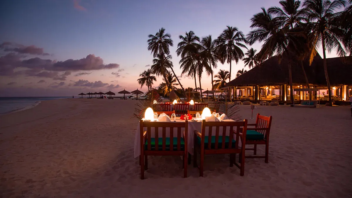 Beach dinner at sunset at Veligandu Island Resort
