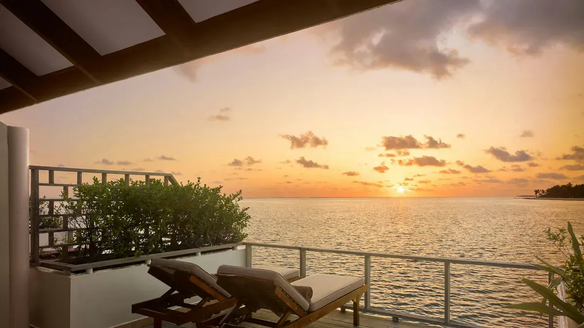 Sunset from a Sunset Water Villa deck at Villa Park Maldives
