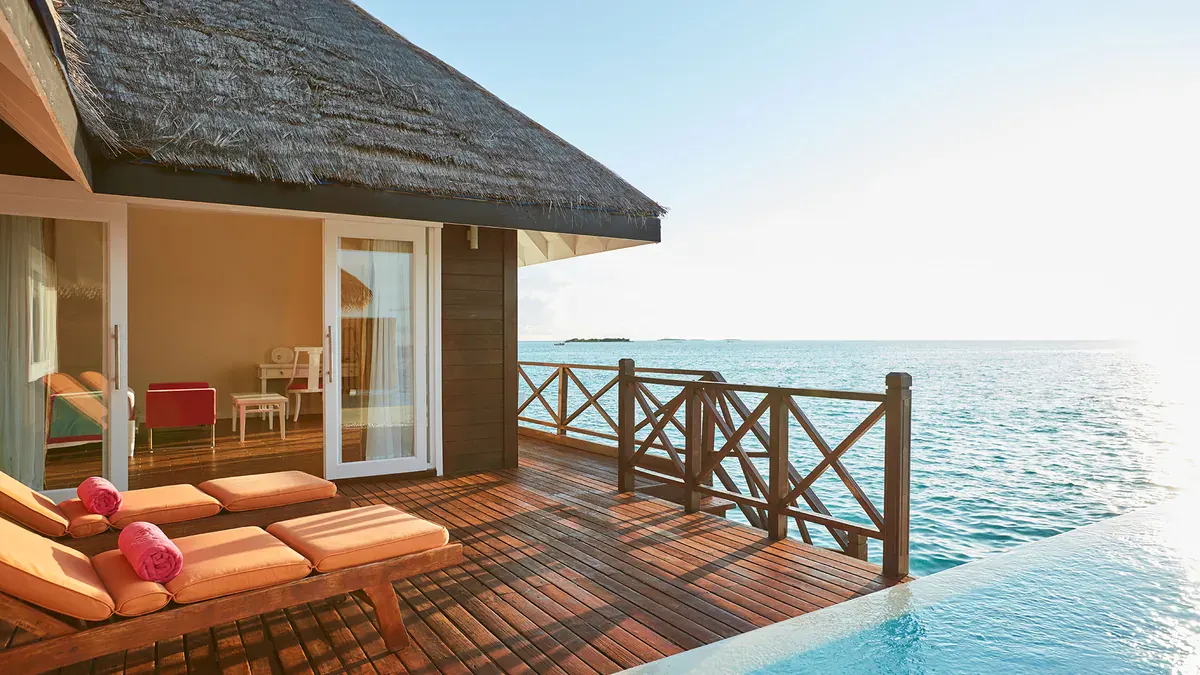 Overwater villa deck facing the lagoon at Sun Siyam Vilu Reef