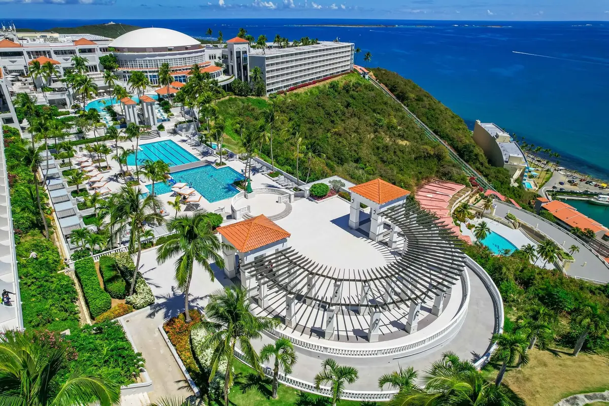 Aerial view of the resort terraces and pools on the clifftop above the sea at Fajardo