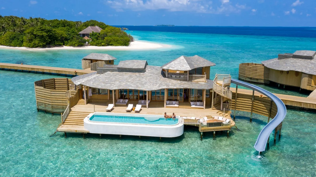 Soneva Fushi overwater Water Retreat with a gentle private slide in Baa Atoll