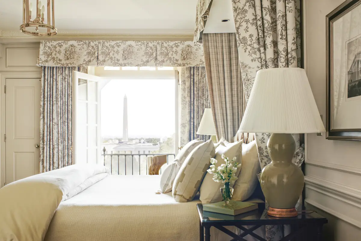 A bedroom at the Hay Adams looking through the window to the Washington Monument