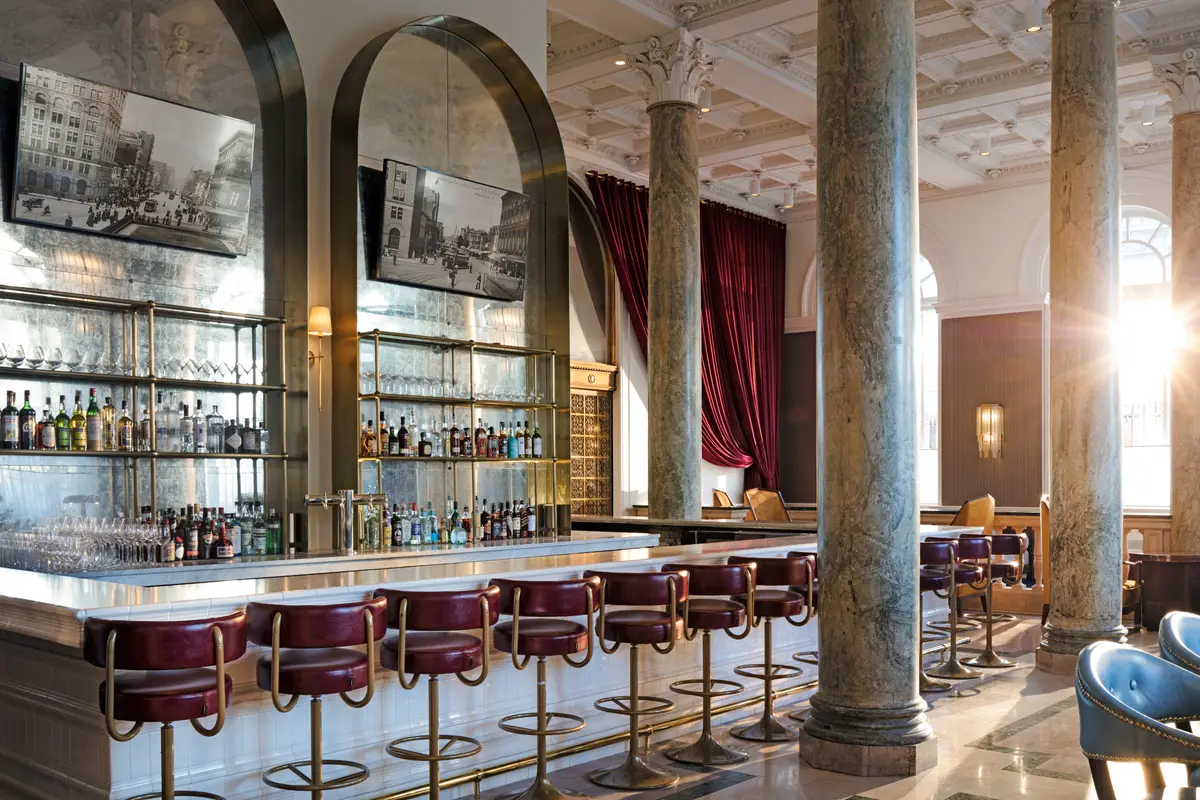 The marble bar and stone columns of Café Riggs in the former banking hall