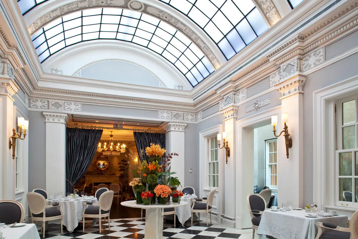 The Greenhouse restaurant at The Jefferson under its arched glass skylight