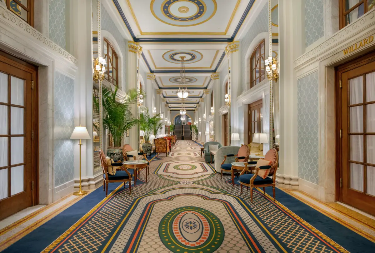 Peacock Alley at the Willard, a long arcade with mosaic flooring and hanging lanterns