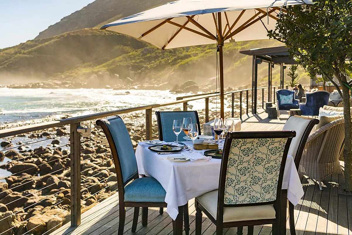Tintswalo Atlantic, Hout Bay, Cape Town: restaurant, bar and dining terrace, photographed for Luxury Hotel Compare