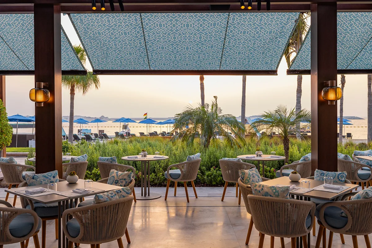 Four Seasons Resort Dubai at Jumeirah Beach, DIFC, Dubai: restaurant, bar and dining terrace, photographed for Luxury Hotel Compare