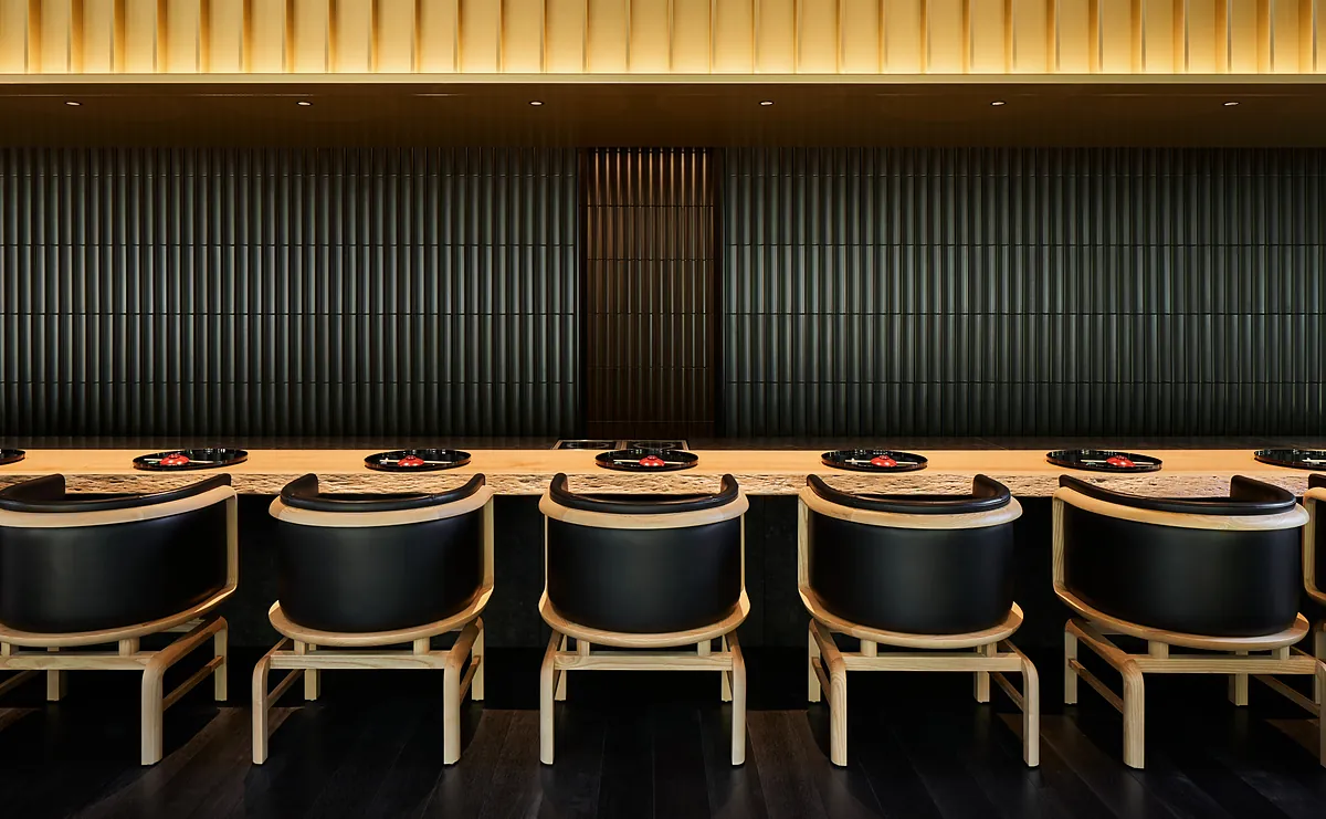Aman Kyoto, the dining counter under its lit timber ceiling, Kyoto