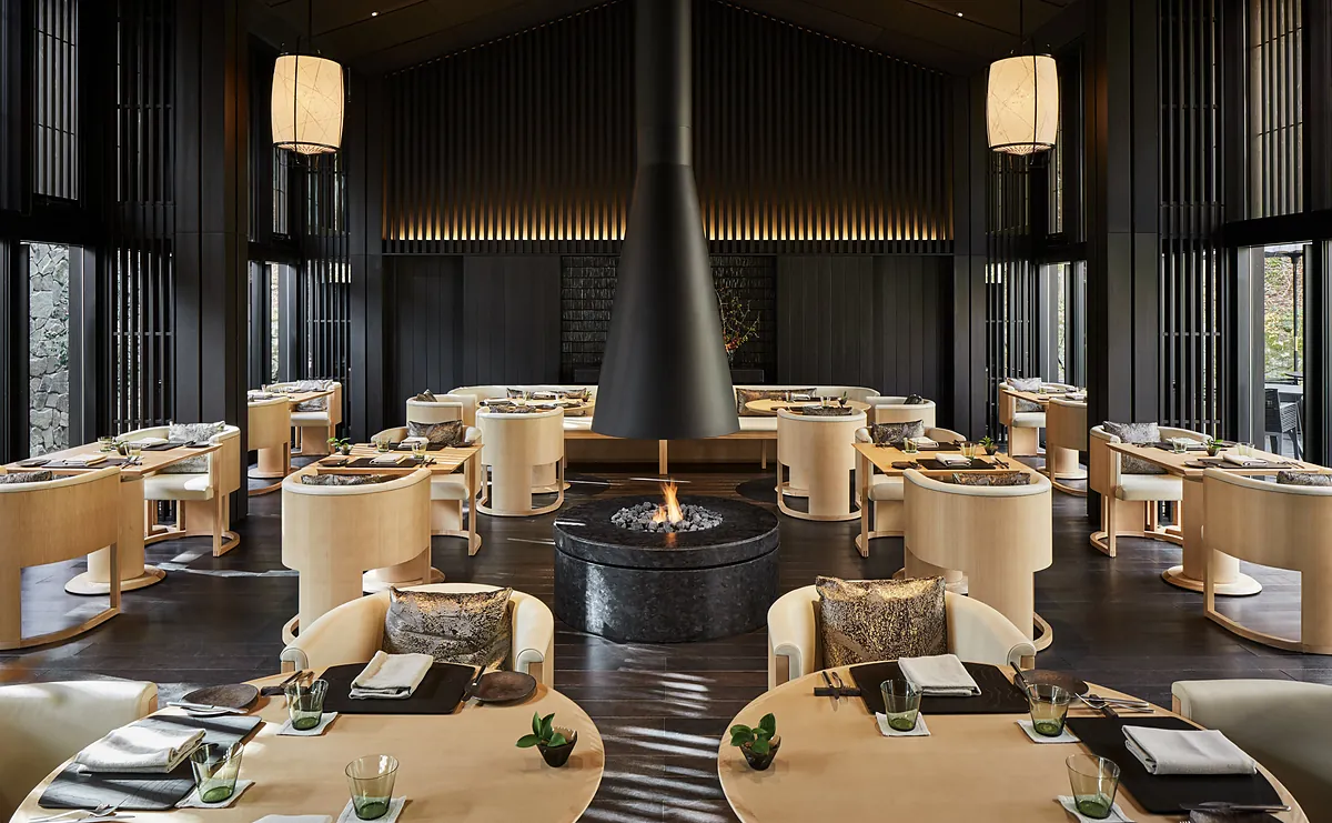 Aman Kyoto, the restaurant arranged around its central fireplace, Kyoto