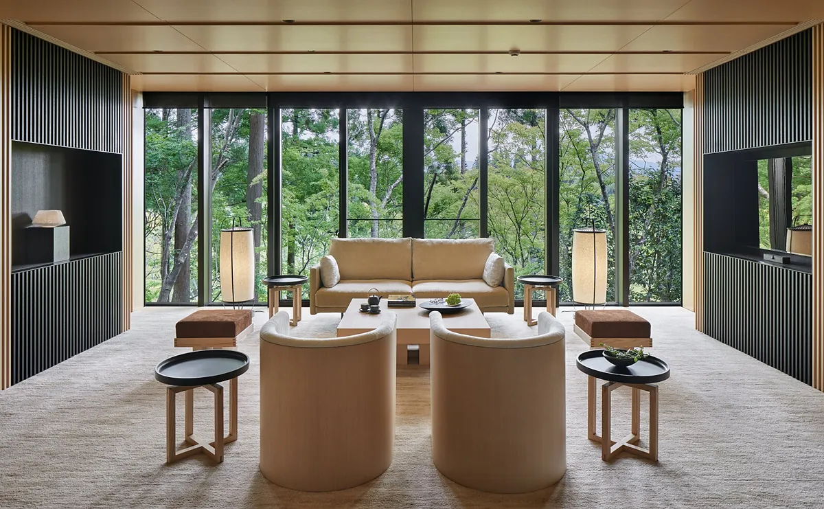 Aman Kyoto, a lounge facing the forest through full height glass, Kyoto