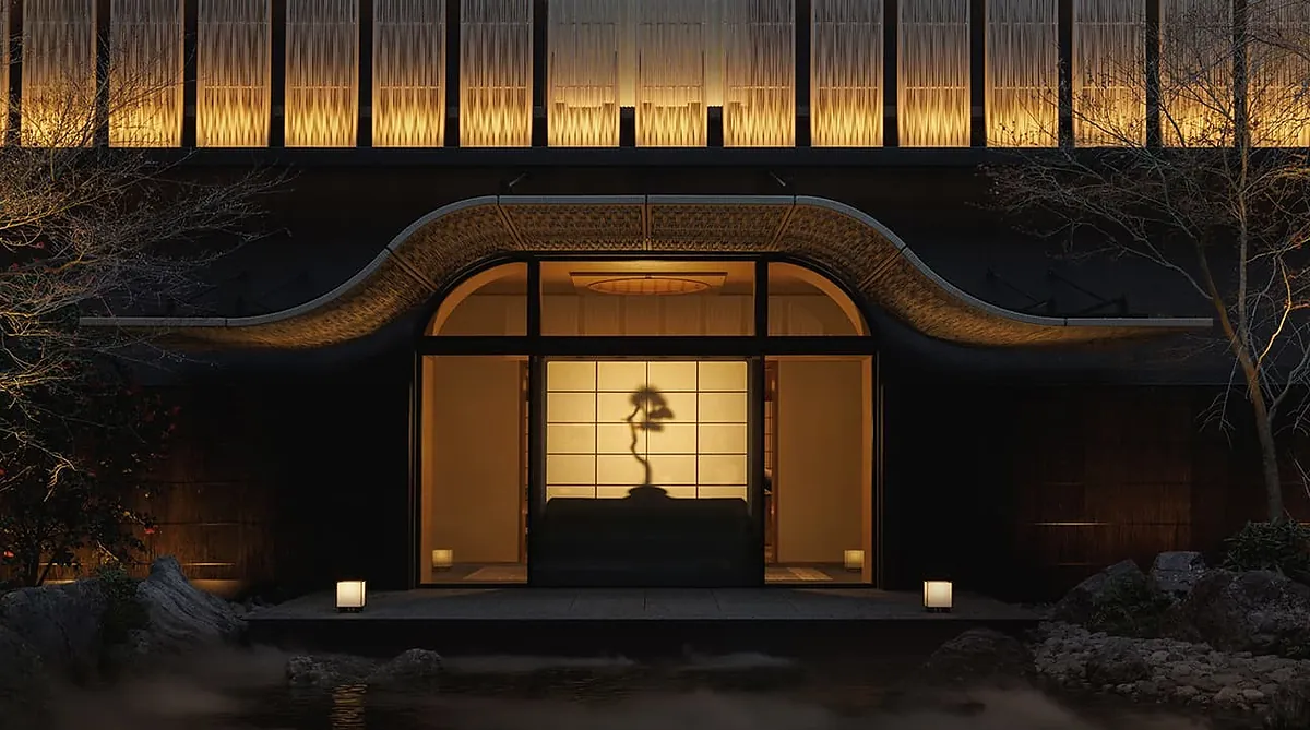 Capella Kyoto, the curved gable of the machiya entrance lit at night, Kyoto