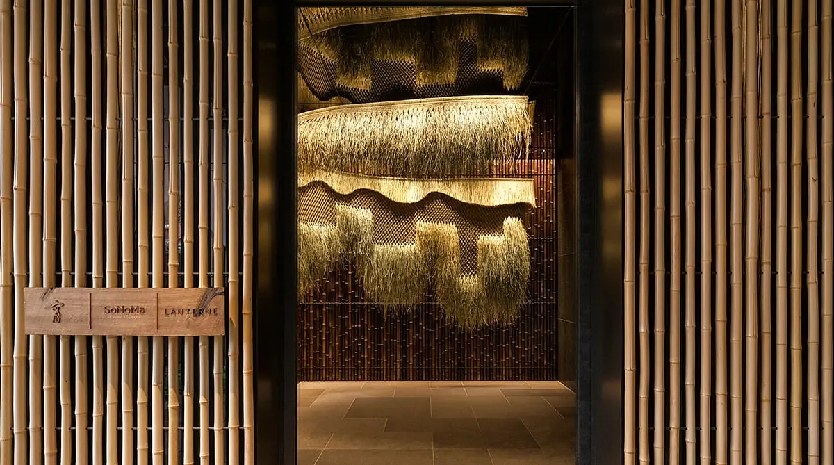 Capella Kyoto, gold textile artwork set between timber screens, Kyoto