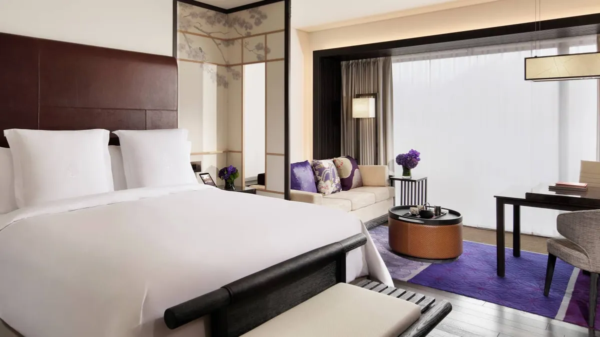 Four Seasons Hotel Kyoto, a bedroom with desk and purple rug, Kyoto