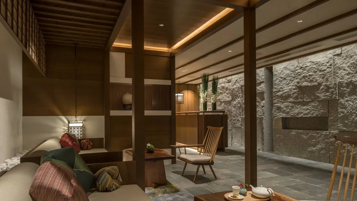 Four Seasons Hotel Kyoto, a room with stone wall and raised tatami platform, Kyoto
