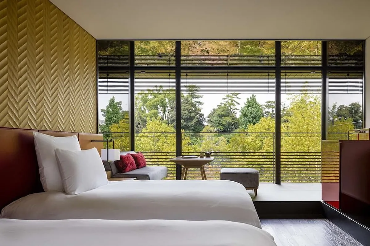 Garrya Nijo Castle Kyoto, twin beds and a window seat above the greenery, Kyoto