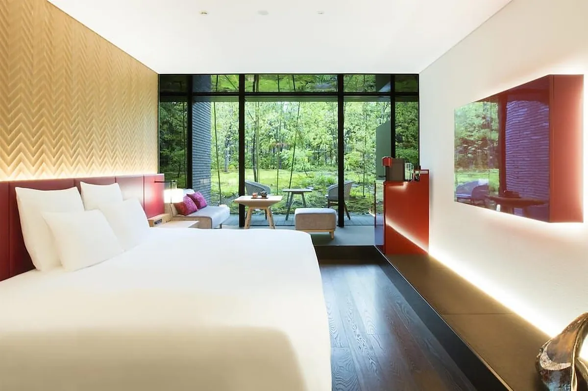 Garrya Nijo Castle Kyoto, a bed in a room with a red inset shelf and garden glass, Kyoto