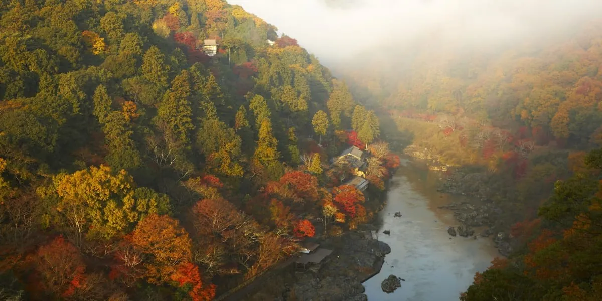 HOSHINOYA Kyoto, the Oi river gorge in autumn mist from above, Kyoto