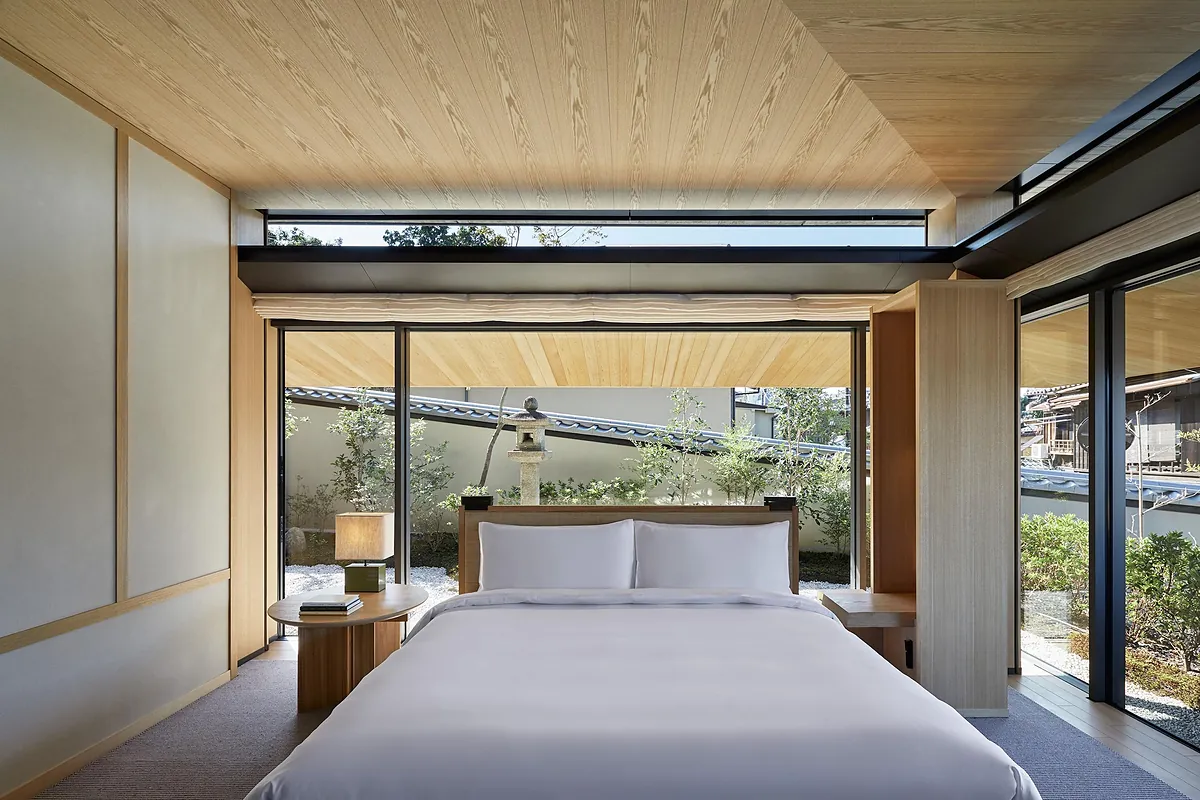 Park Hyatt Kyoto, a bed in a timber ceilinged room open to its terrace, Kyoto