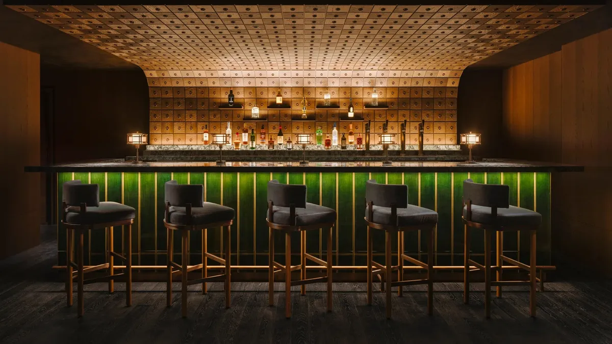 Six Senses Kyoto, the bar with green backlit shelves and stools, Kyoto