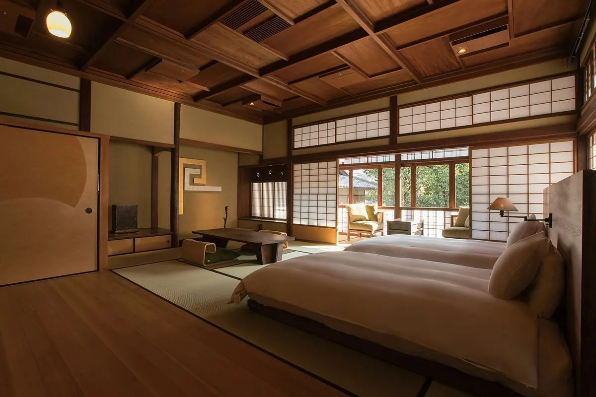 SOWAKA, a bed in a tatami room with a sitting alcove beyond the shoji, Kyoto