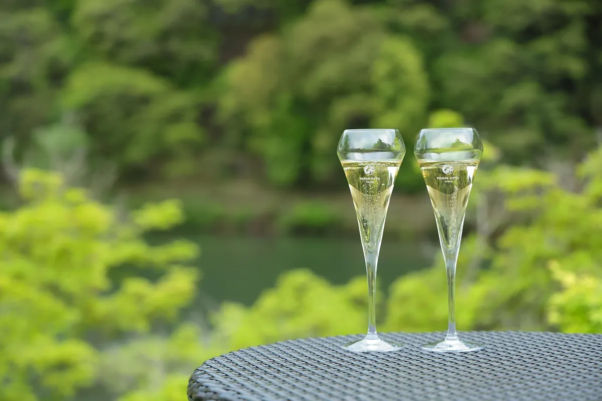Suiran Kyoto, two glasses on a table against the garden, Kyoto
