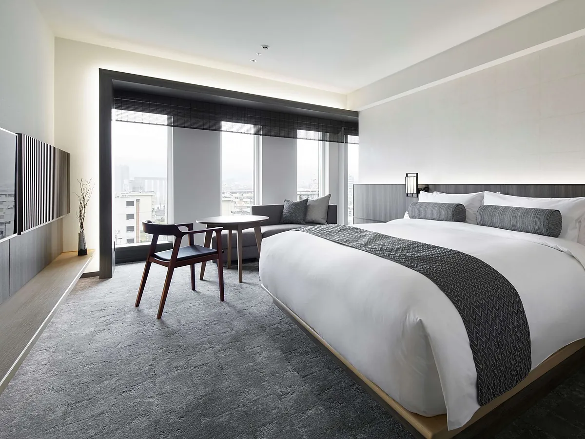 THE THOUSAND KYOTO, a bed and desk in a grey and white room, Kyoto