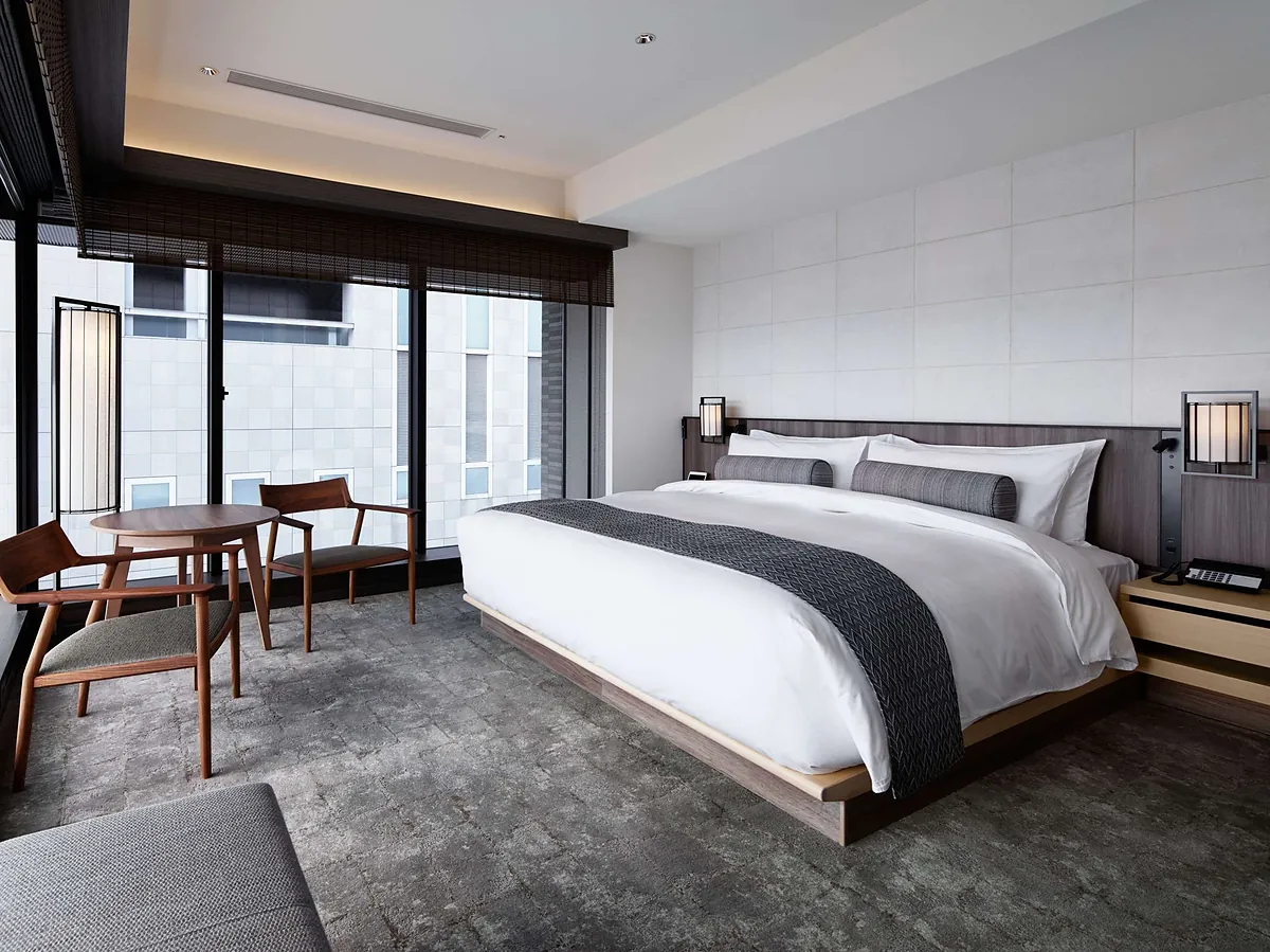 THE THOUSAND KYOTO, a bed behind a timber screen at the window, Kyoto