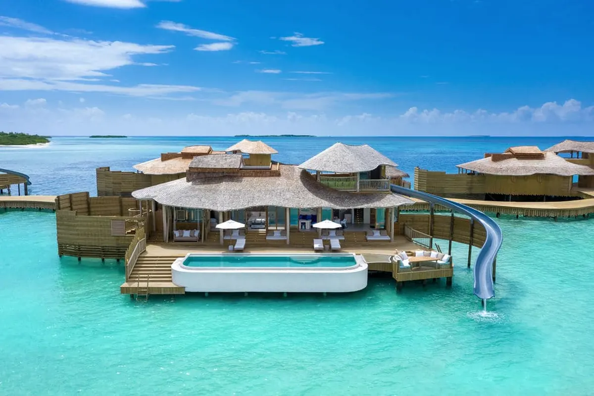 Soneva Jani vs Soneva Fushi: Overwater Drama or Barefoot Jungle?, A 1 Bedroom Water Reserve with Slide at Soneva Jani, set over the Noonu Atoll lagoon