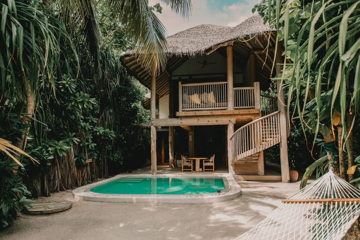Soneva Jani vs Soneva Fushi: Overwater Drama or Barefoot Jungle?, A Crusoe Suite with Pool hidden among the trees at Soneva Fushi