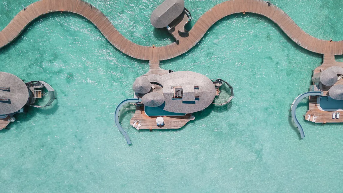 Soneva Jani Review: The Overwater Villas With Slides, Priced Honestly, Master bedroom with the retractable roof open to the sky