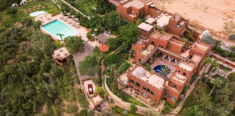 Kasbah Tamadot Atlas Mountains infinity pool with mountain panorama