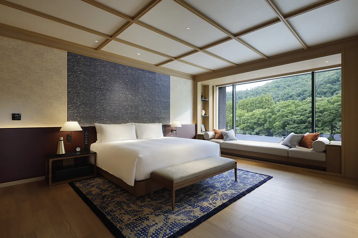 Peak Suite bedroom with hillside view at ROKU KYOTO